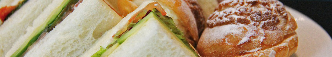 Eating Deli Sandwich at Squeeze Inn Sandwich Shop restaurant in Medford, OR.